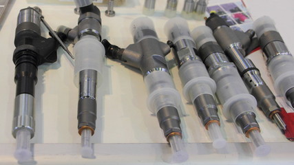 New car engine injector nozzle close up, fuel system repair