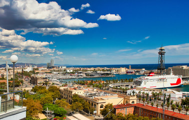 generic view from a high angle overlooking the beach and port of the touristic Barcelona in Spain 