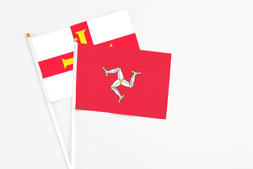 Isle Of Man and Guernsey stick flags on white background. High quality fabric, miniature national...