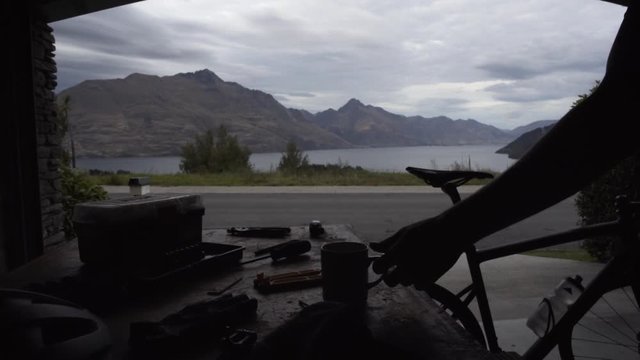 Silhouette cyclist having break before workout Lake Wakatipu 