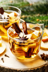 Hot drink for New Year, Christmas or autumn holidays. Mulled cider or spiced tea or mulled white...