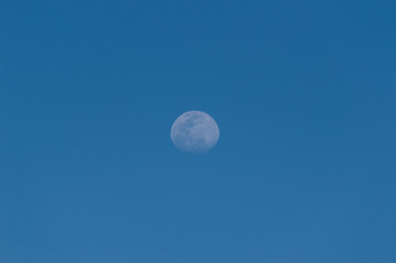 Crisp Full Moon At Sunset On Las Americas Beach. April 11, 2019. Santa Cruz De Tenerife Spain Africa. Travel Tourism Street Photography.