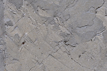 Wall background texture. Gray plaster in cracks. For design and web design, creating games 3D texturing. Wall murals.