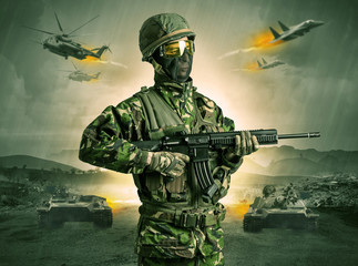 Armed soldier with sniper in the middle of a war