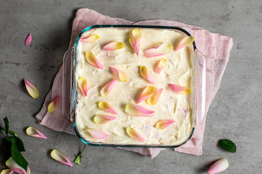 Overhead view of rhubarb trifle with rose petals