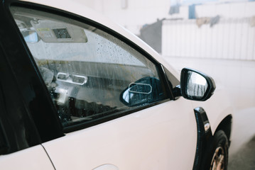 Washing car. Close up. High Pressure Water jet.