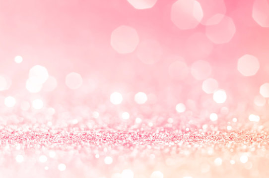 Pink gold, pink bokeh,circle abstract light background,Pink Gold shining lights, sparkling glittering Valentines day,women day or event lights romantic backdrop.Blurred abstract holiday background.