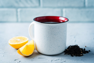 Cup of black tea with honey, lemon and ginger