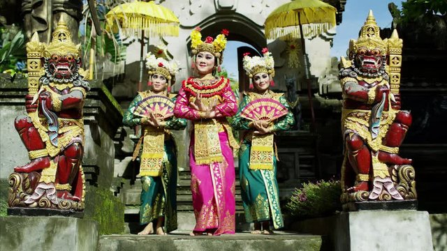 Females wearing jewelled headdress Hindu temple Ubud Indonesia 