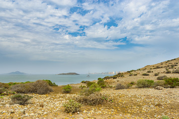 Seascape with a white yacht in La Manga del Mar Menor on a sunny day. Murcia, Spain