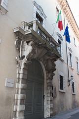 Fototapeta na wymiar Entrance of an old building in Via dei Musei in Brescia, Lombardy, Italy.