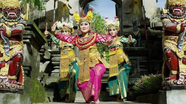 Females performing ancient religious dance Hindu temple Indonesia