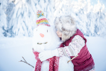 mature woman kiss a really snowman