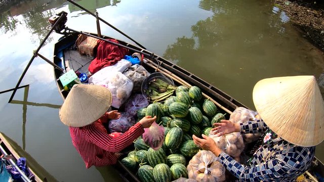 Trading on the Mekong floating market vendor Vietnam