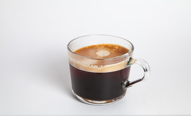 brewed coffee with foam in a glass mug Flavored coffee