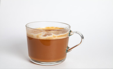 brewed coffee with foam in a glass mug Flavored coffee