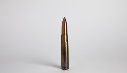 dummy bullet from an automatic weapon on a white background