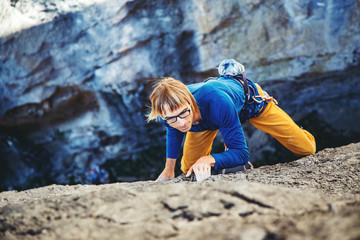 Man climbing a rock.
