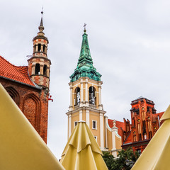 Fototapeta na wymiar Holy Spirit Church. Spiers in the historical center of Torun, Poland. August 2019