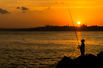 fisherman in the sunset