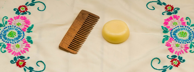 A comb and soap on the table