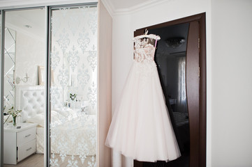 Fototapeta na wymiar Elegant white wedding dress at bride morning.