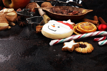 Baking christmas cookies. Typical cinnamon stars bakery with spices. xmas decoration on table
