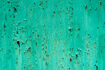 photo of metal with old paint. rust under the paint.