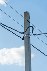 Power pole. Photo of a pole with electric wires against the sky.