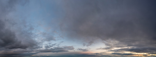 Fantastic clouds against blue sky, panorama