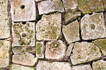 Old brick paving background closeup. Vintage brick texture