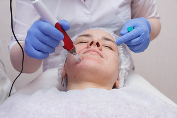 Naklejka premium The process of mesotarpia with the introduction of serum under the skin
