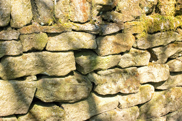 Stone wall. Abstract dry stones in boundary wall in Derbyshire Peak District countryside.  Stone material construction, natural and textured.