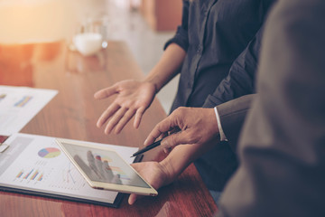Business team analyzing financial documents in office