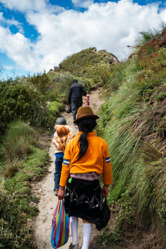 Family walking back from the market - Quilotoa