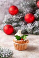 Christmas festive cupcake with holly leaves