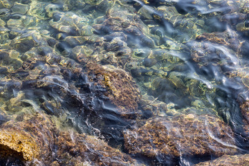 Fototapeta na wymiar rocks and sea waves background
