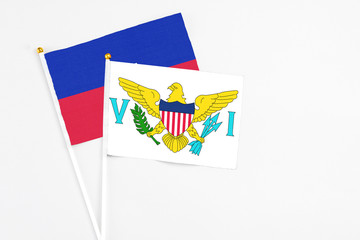 United States Virgin Islands and Haiti stick flags on white background. High quality fabric,...