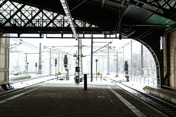Empty european train station platform under roof
