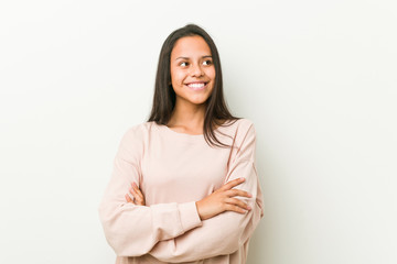 Young cute hispanic teenager woman smiling confident with crossed arms.