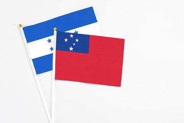 Samoa and Honduras stick flags on white background. High quality fabric, miniature national flag....