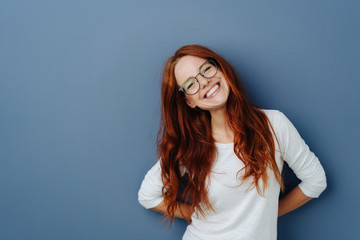 Happy attractive young redhead woman - obrazy, fototapety, plakaty