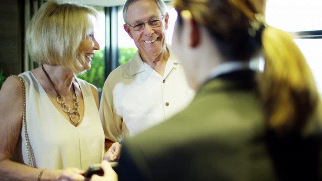 Caucasian seniors using Hong Kong hotel concierge service 