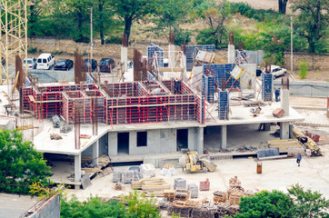 Aerial view of construction site, construction of new building in residential area