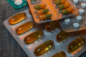 pills in blister isolated on grey background