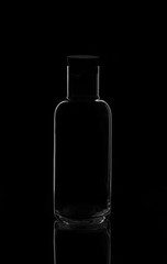 Empty bottle or decanter isolated on a dark background