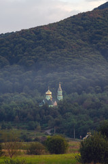 Orthodox monastery in a forest valley. Natural landscape. Transcarpathia Ukraine