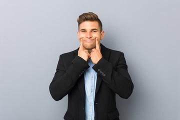 Young handsome caucasian man doubting between two options.