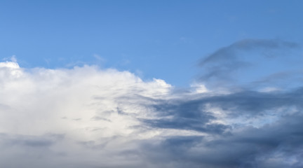 Beautiful white and grey clouds and cloud formations on a deep blue sky