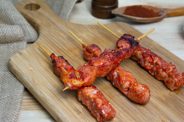 Pinchos morunos  or meat skewer. Typical Spanish cuisine dish made with pork or chicken carn marinated with garlic and paprika